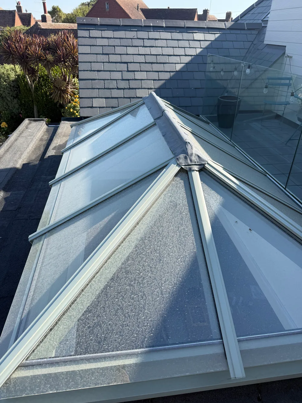 Clean lantern roof glazing after cleaning, ridge bar clear of grime